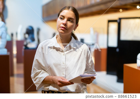 Woman visiting sculpture hall in historical museum 88661523