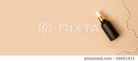 Amber matt glass dropper bottle with white lid in water on beige light background. Skincare products , natural cosmetic. Beauty concept for face and body care 88661933