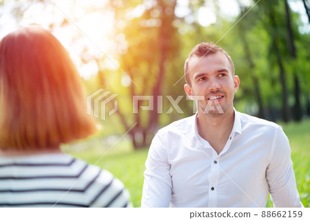 Couple with a dog in the park 88662159
