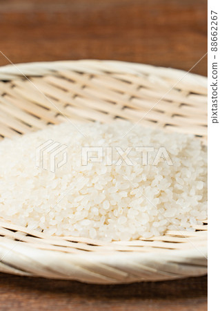Raw rice in a colander 88662267