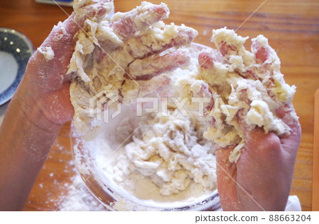 Hands with bread dough 88663204