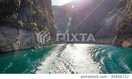 Double water footprints from a boat on the water in Green Canyon in Turkey Double water footprints from a boat on the water in Green Canyon in Turkey 88666152