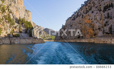 Double water footprints from a boat on the water in Green Canyon in Turkey Double water footprints from a boat on the water in Green Canyon in Turkey 88666153