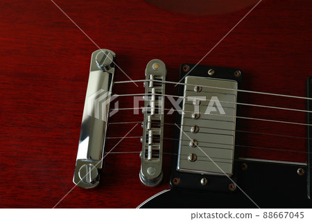 Red electric guitar all over background, close up 88667045