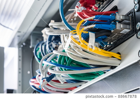 fiber optic cables connected to optic ports, network cables connected to ethernet ports fiber optic cables connected to optic ports, network cables connected to ethernet ports 88667878