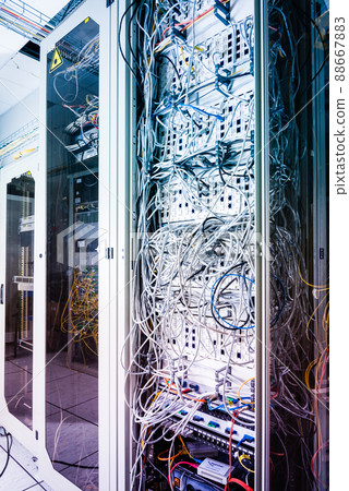 server inside data center with ethernet cables connected to data switch 88667883
