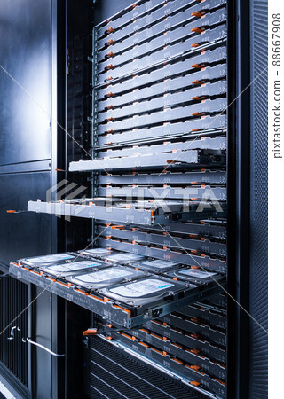 close up of hard disk drives inside hosting center - server rack filled with trays full of data storage drives 88667908