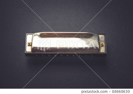 Vintage harmonica isolated on black Vintage harmonica isolated on black 88668630