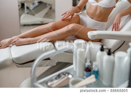 Cropped shot of body of woman ready for hair removal, skin treatment at spa beauty center 88668805