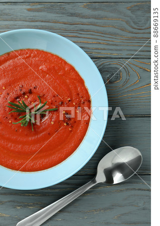 Concept of tasty eating with Gazpacho soup on gray wooden background Concept of tasty eating with Gazpacho soup on gray wooden background 88669135