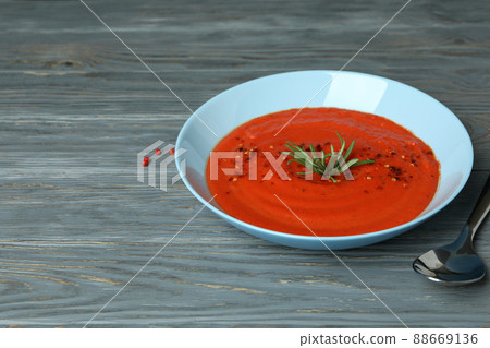 Concept of tasty eating with Gazpacho soup on gray wooden background 88669136