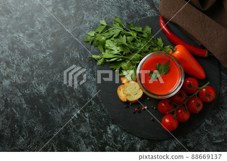Concept of tasty eating with Gazpacho soup on black smokey background Concept of tasty eating with Gazpacho soup on black smokey background 88669137