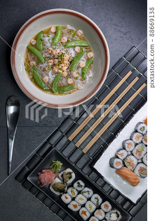 Various dishes of Asian cuisine with typical sushi 88669138