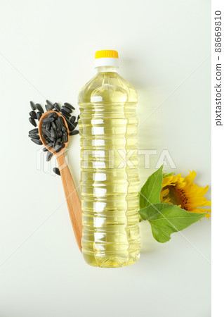 Bottle of sunflower oil and ingredients on white background Bottle of sunflower oil and ingredients on white background 88669810