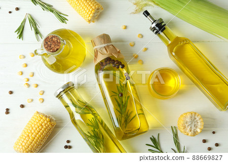 Set of different oils on white wooden table Set of different oils on white wooden table 88669827