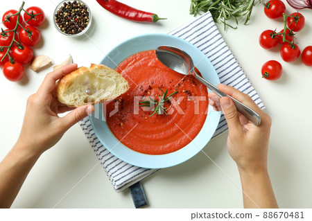 Concept of tasty eating with Gazpacho soup on white background 88670481