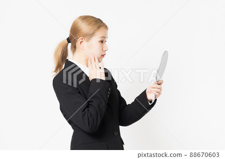 A woman in a jacket to check her skin A woman in a jacket to check her skin 88670603