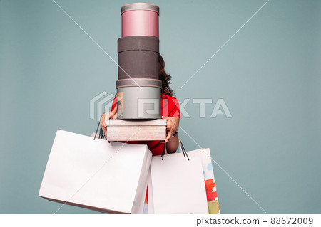 Unrecognizable lady with lots of boxes and Unrecognizable lady with lots of boxes and 88672009