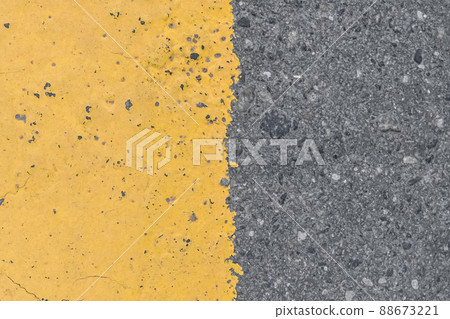 Asphalt street road markings with yellow paint abstract background design pattern Asphalt street road markings with yellow paint abstract background design pattern 88673221