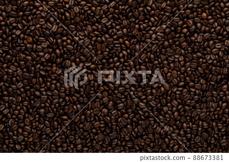 Coffee beans texture in roasting process. Dark brown abstract background Coffee beans texture in roasting process. Dark brown abstract background 88673381