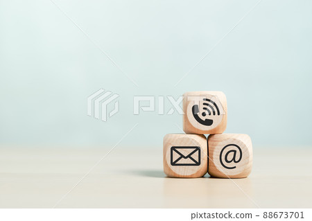 blank wooden cubes square dice with symbol email telephone address placed on wood background. 88673701