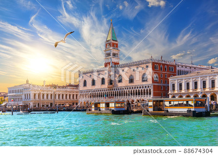 Picturesque shore of Venice, bright sky and a seagull, Italy Picturesque shore of Venice, bright sky and a seagull, Italy 88674304