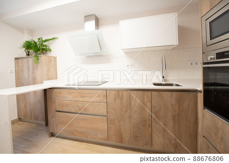 modern kitchen with all its appliances in a home modern kitchen with all its appliances in a home 88676806