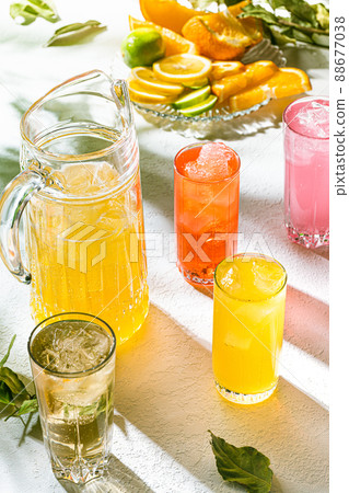 Iced cold fresh fruit juice, healthy drinks. Summer background Iced cold fresh fruit juice, healthy drinks. Summer background 88677038