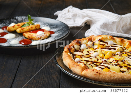 Sweet pie with banana, orange, cranberry and caramel syrup Sweet pie with banana, orange, cranberry and caramel syrup 88677532