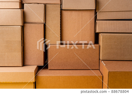Cardboard boxes stacked in a pile as a background 88678804