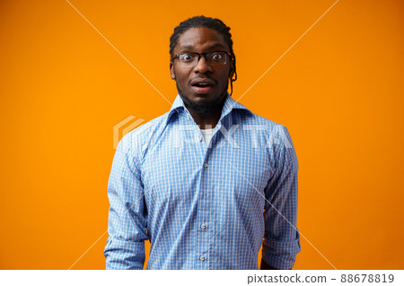 Photo of excited ecstatic overjoyed black man against yellow background 88678819
