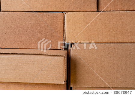 Cardboard boxes stacked in a pile as a background Cardboard boxes stacked in a pile as a background 88678947