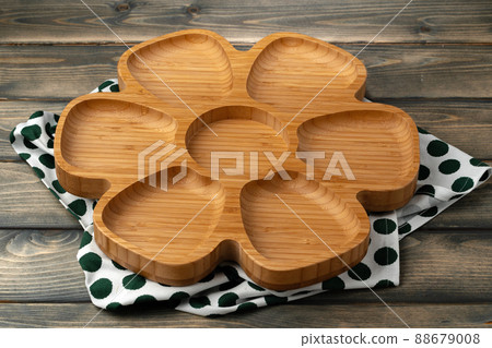 Wooden board with kitchen napkin on dark wooden table 88679008