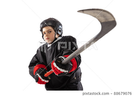 Portrait of boy, child, hockey player posing, training isolated over white studio background Portrait of boy, child, hockey player posing, training isolated over white studio background 88679076