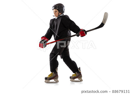 Little sportsman, hockey player training isolated over white studio background. 88679131