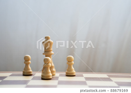 White queen and pawns on chess board White queen and pawns on chess board 88679169