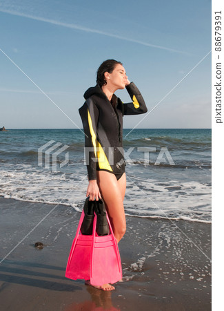 woman in the seaside after dive woman in the seaside after dive 88679391