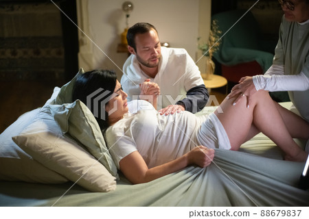 Exhausted pregnant woman during birth contractions 88679837