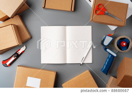 Above table top view of warehouse preparing post courier delivery package Above table top view of warehouse preparing post courier delivery package 88680087