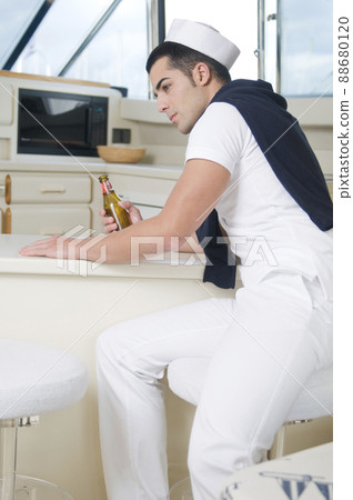 young sailor on a private yacht ready to sail young sailor on a private yacht ready to sail 88680120