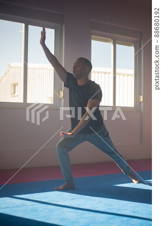 Multi-ethnic man practicing Qi Gong 88680192