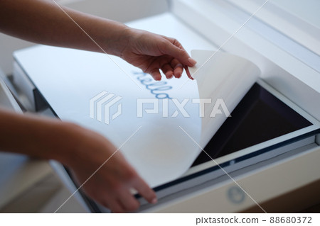 Tbilisi, Georgia - April 11, 2022: Woman removing protective film from New iMac monitor Tbilisi, Georgia - April 11, 2022: Woman removing protective film from New iMac monitor 88680372
