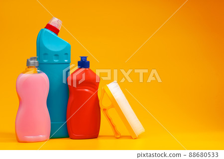 House cleaning detergent bottles on a yellow background 88680533