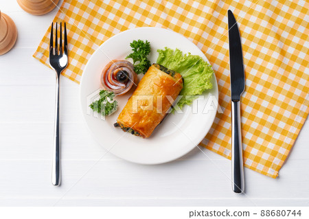 Traditional Russian pie or patty on white plate 88680744