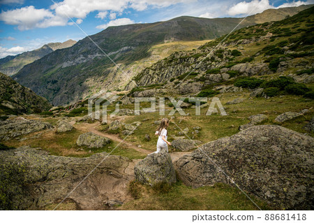 A girl hiking in the mountain at summer 88681418