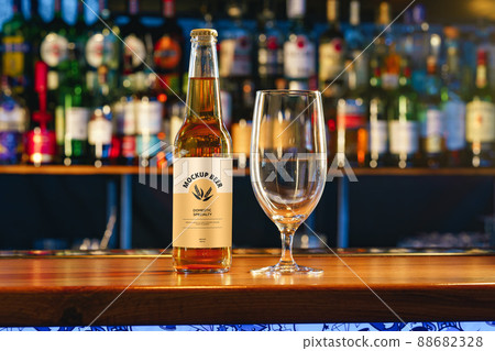 Beer bottle mock-up against blurred bar counter Beer bottle mock-up against blurred bar counter 88682328