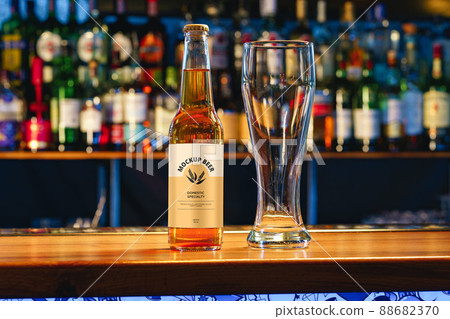 Beer bottle mock-up against blurred bar counter 88682370