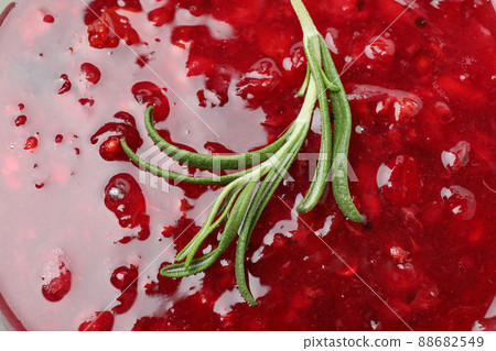 Cranberry sauce with rosemary all over background 88682549