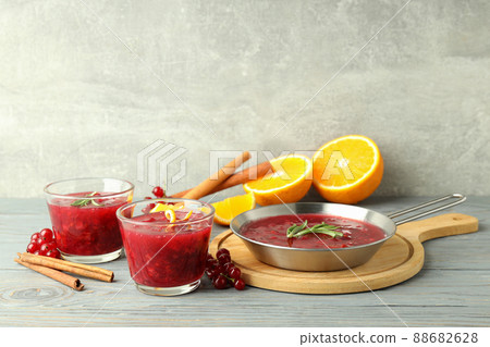 Cranberry sauce and ingredients on gray wooden table Cranberry sauce and ingredients on gray wooden table 88682628