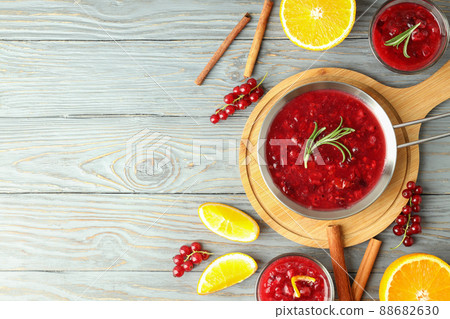 Cranberry sauce and ingredients on gray wooden table Cranberry sauce and ingredients on gray wooden table 88682630